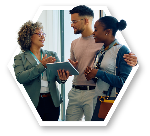 Diverse group of professionals engaged in a discussion, with one holding a tablet.